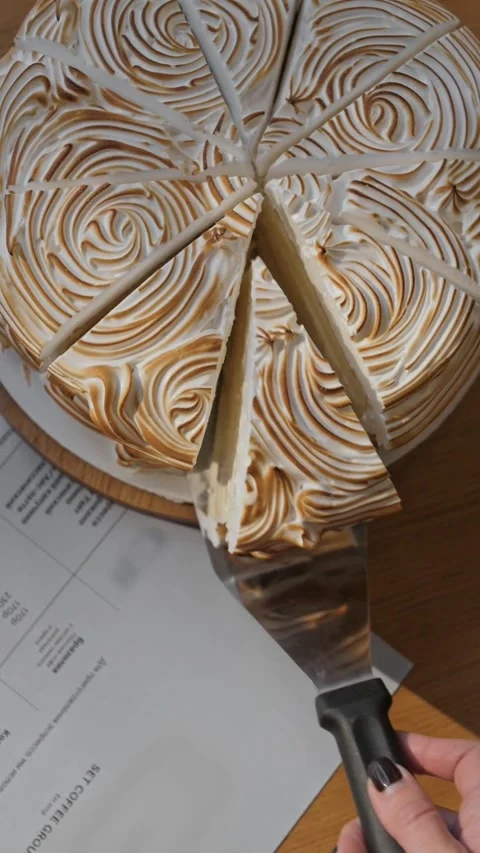 Cake divided into pieces is distributed among Vídeo Stock 310942867