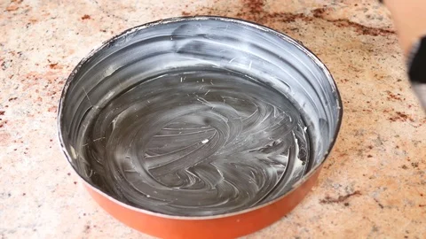 The cake dough is poured into a mould. Video stock 94968321