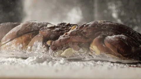 Cake dropped onto counter with flour Stock Footage 274689067