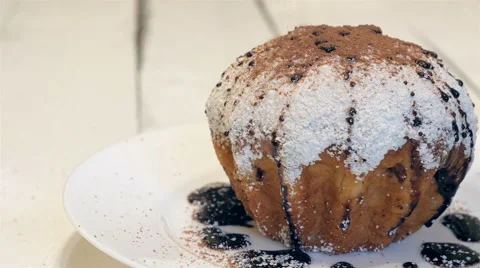 Cake dusted with coconut sprinkled with cocoa Stock Footage 58288477