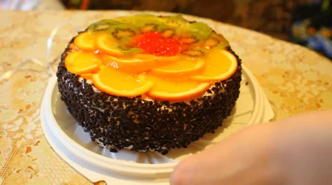 Cake filled with fruit cut into pieces Stock Footage 49942533