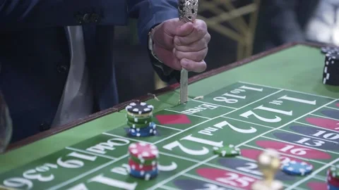 A cake in the form of a gaming table in a casino, people cut into pieces. Stock Footage 228490147