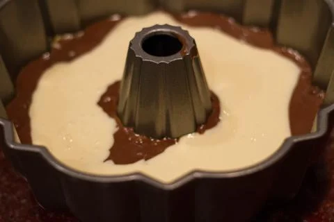 Cake in the form with ingredients Stock Photos