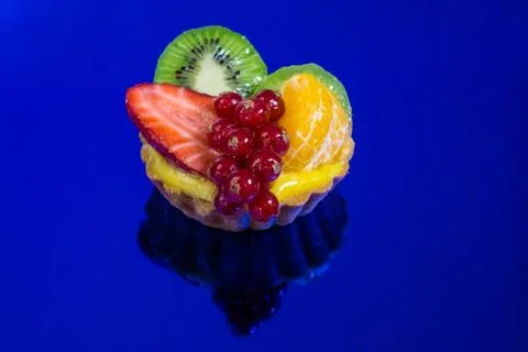Cake with fresh bio fruit, orange, kiwi, red currants, strawberries Stock Photos