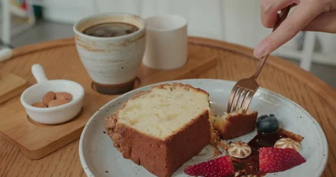 Cake with hot coffee in cafe Stock Footage 143177796