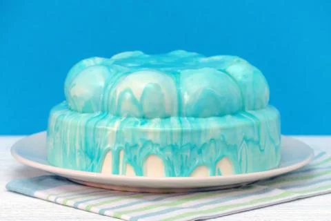 Cake icing closeup, selective focus on blue background Stock Photos