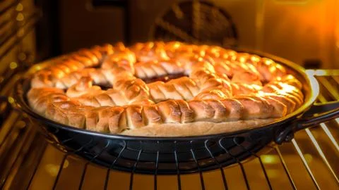 Cake with jam in the oven Stock Photos