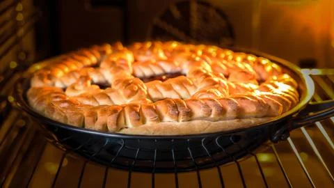 Cake with jam in the oven Stock Photos