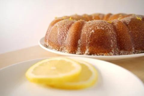 Cake with lemon slices in the foreground Foto stock