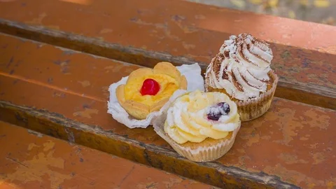 Cake lie on the bench Stock Footage 75811357