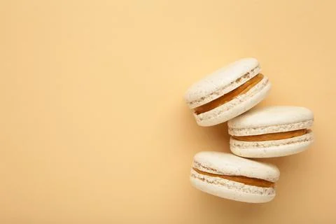 Cake macaron or macaroon on beige background. Space for text Fotos Stock