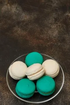 Cake macaron or macaroon on brown background, almond cookies Stock Photos