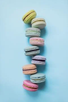 Cake macaron or macaroon on pastel blue background from above. Top view. Stock Photos