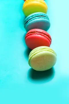 Cake macaron or macaroon on turquoise background, pastel colors Fotos Stock
