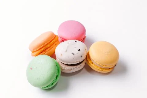Cake macaron or macaroon on turquoise background from above, colorful almond  Stock Photos