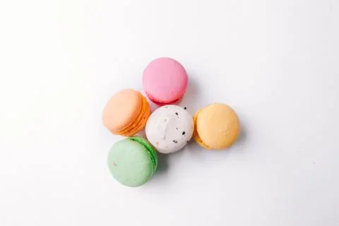 Cake macaron or macaroon on turquoise background from above, colorful almond  Stock Photos