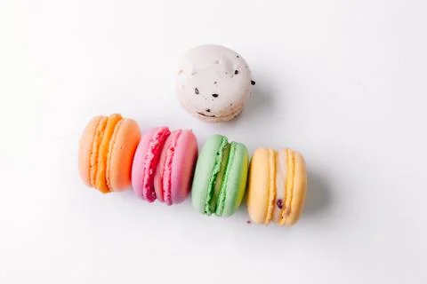 Cake macaron or macaroon on turquoise background from above, colorful almond  Stock Photos