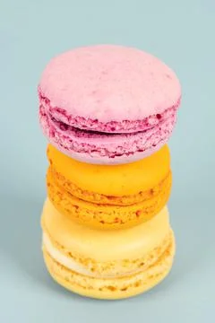 Cake macaron or macaroon on turquoise background from above, colorful almond  Stock Photos