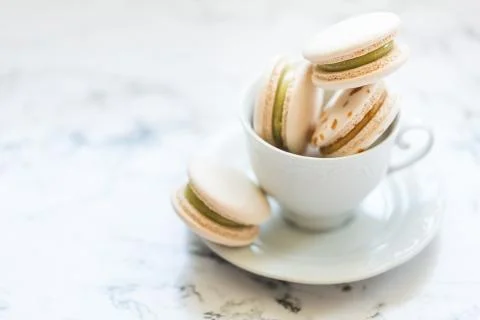 Cake macaroons, macaron in white cup Stock Photos