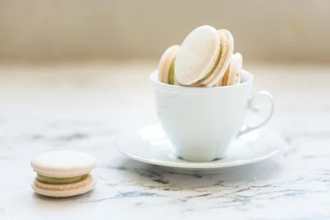 Cake macaroons, macaron in white cup Stock Photos