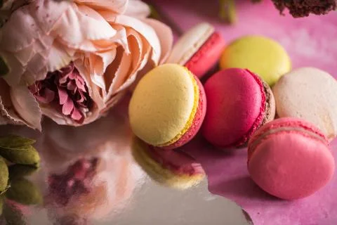 Cake macaroons on pink background. Close up macaron dessert on top view Stock Photos