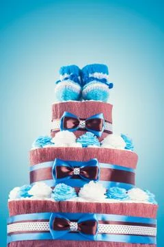 Cake made from diapers on blue background Stock Photos
