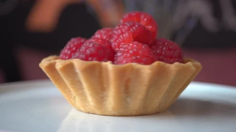 Cake made of shortcrust pastry full of fresh raspberries Stock Footage 118461219