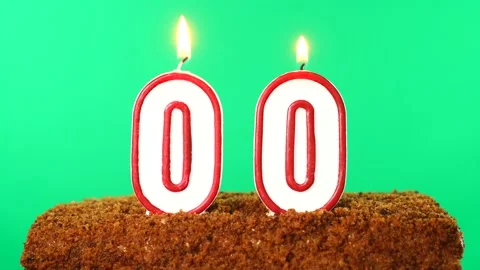 Cake with the number 00 lighted candle. Chroma key. Green Screen. Isolated Stock Footage 139190179