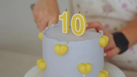 Cake with the number 10, cake slicing, cake in slow motion Stock Footage 282781933