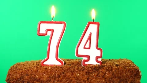Cake with the number 74 lighted candle. Chroma key. Green Screen. Isolated Stock Footage 139162326