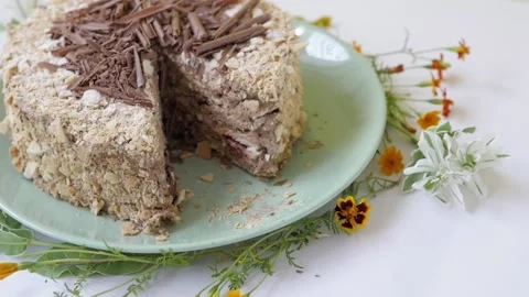 Cake with nuts and chocolate, decorated with chocolate chips. cake stands on a Stock-Footage 147567523