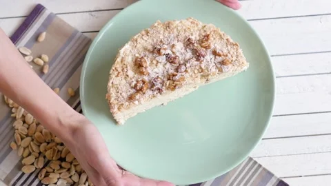 Cake with nuts on a light background. cake decorated with peanuts, top view. The Stock-Footage 147518913