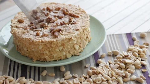 Cake with nuts on a light background. cake decorated with peanuts, side view Stock-Footage 147567557