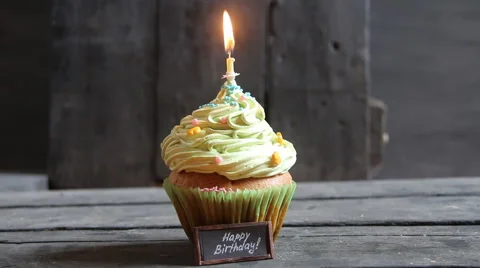 Cake with one candle, birthday candle that have just been blown out with smoke Stock Footage
