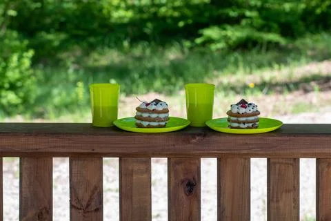 A cake or honey cake stands on a wooden table board with a copyspace Stock Photos