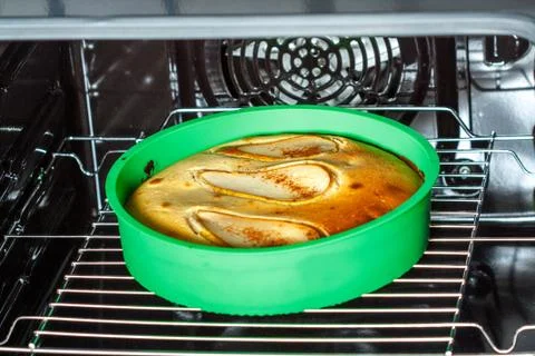 Cake in the oven Stock Photos