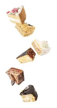 Cake pieces in the air. Falling down cake slices isolated on white backgroung Stock Photos