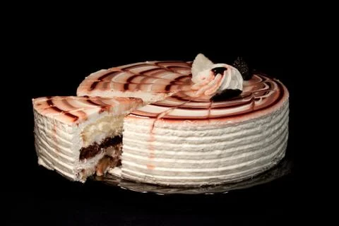 Cake on a plate on a black background Stock Photos