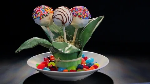 Cake pop desserts in rotating plate setting 2 Stock Footage 102137995