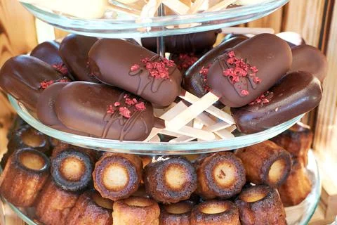 Cake pops in dark chocolate in the shape of a mini ice cream on a stick. cann Stock Photos