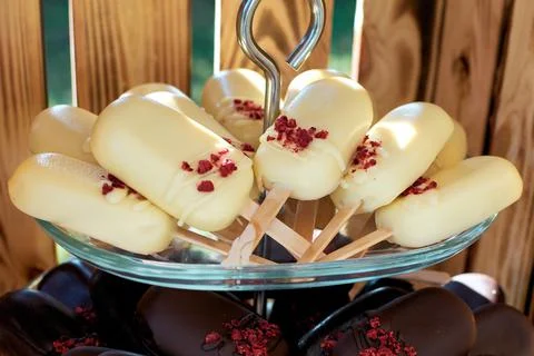 Cake pops in white and dark chocolate. Ice cream cake on a bag. Selective foc Stock Photos