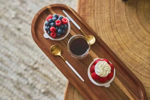 Cake with raspberry and cup of coffee. Stock Photos