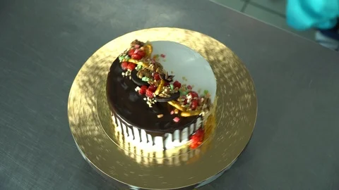 The cake revolves on a tray Stock Footage 85663763