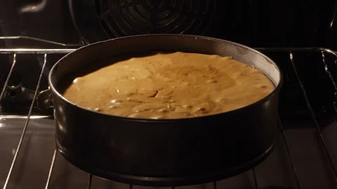 Cake rising in the oven Stock Footage 83014955