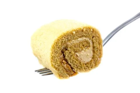 Cake roll on white background with a spoon Stock Photos