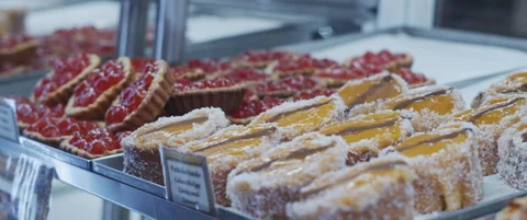 Cake rolls in bakery shop window Stock Footage 152582926