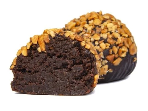 Cake rum truffle two balls with chopped nuts isolated on the white background Stock Photos
