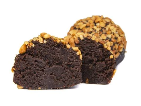 Cake rum truffle two balls with chopped nuts isolated on the white background Stock Photos