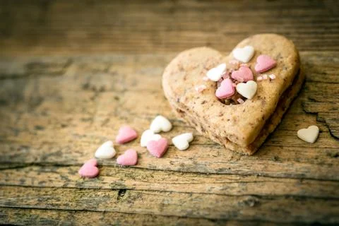 Cake in the shape of a heart with decoration Stock Photos