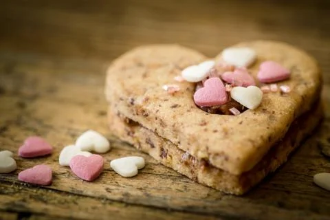 Cake in the shape of a heart with decoration Stock Photos